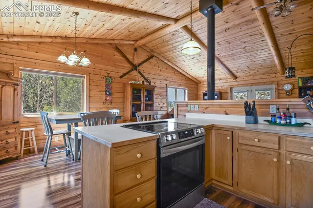 a kitchen that has a cabinets and a stove