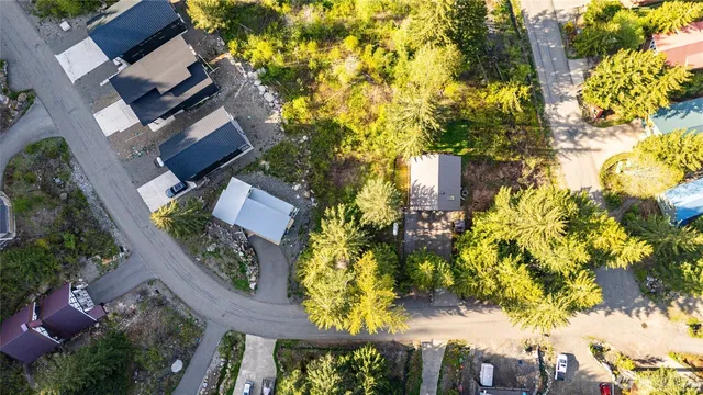 an aerial view of residential house with swimming pool and lawn chairs