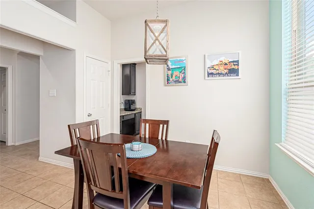 a kitchen with stainless steel appliances granite countertop a sink and a refrigerator