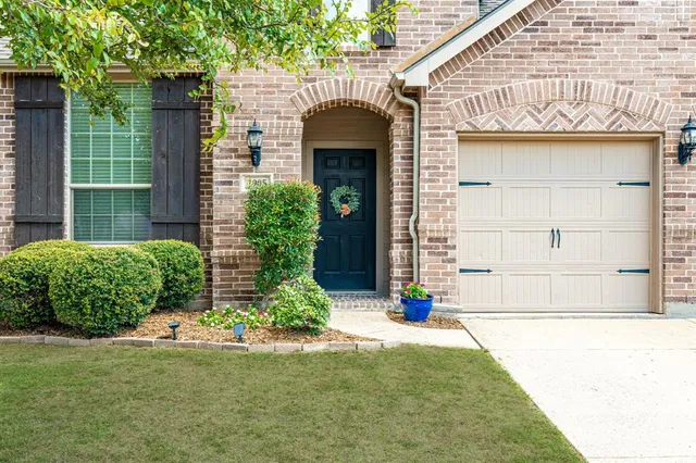 an aerial view of house with yard