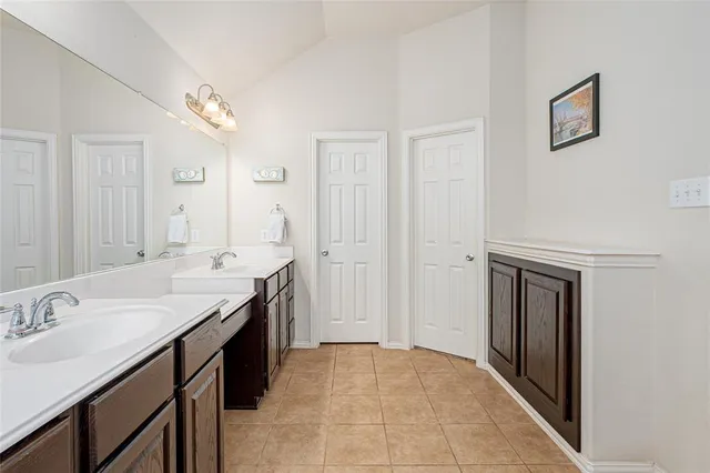 a bedroom with furniture and a flat screen tv