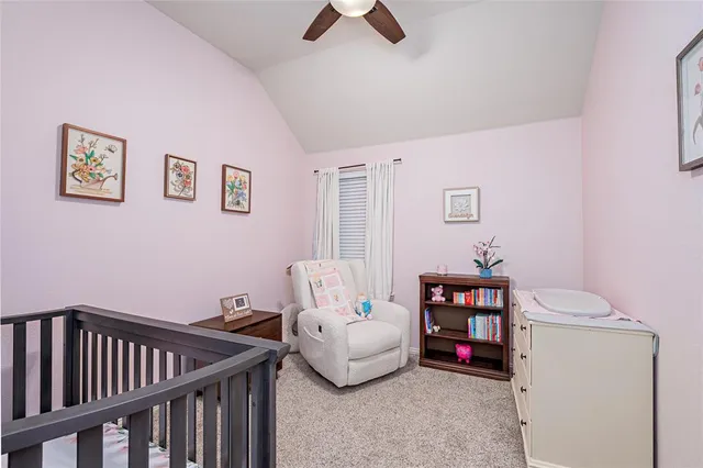 a bedroom with a bed and flat screen tv