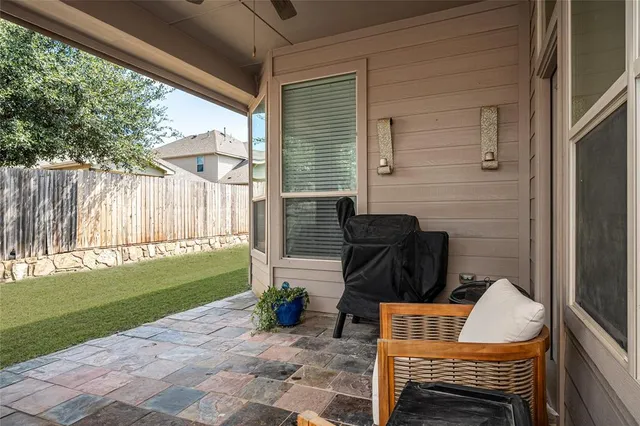 a view of dinning table and chairs in patio