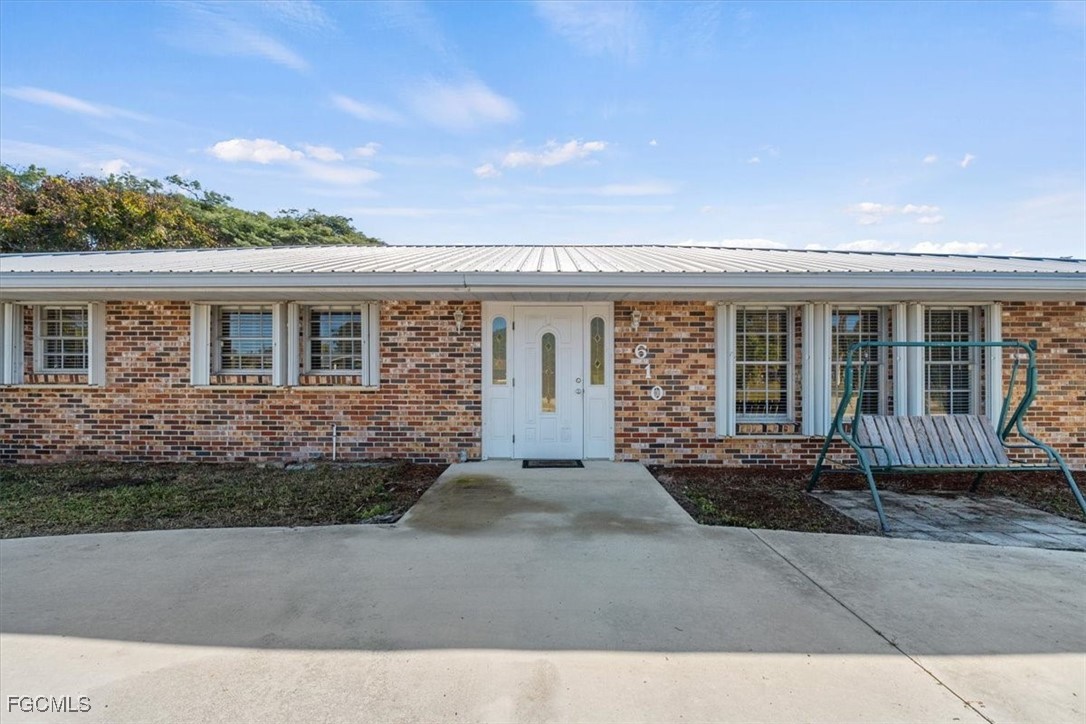 610 East Avenida Del Rio Clewiston, FL 33440 - Photo 3 of 49 front view of a house with a patio
