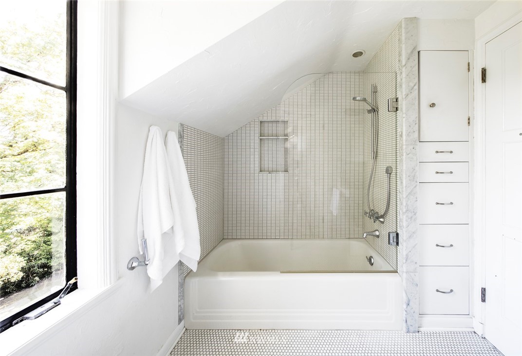 1668 East Boston Terrace Seattle, WA 98112 - Photo 13 of 24 a bathroom with a bathtub and a shower