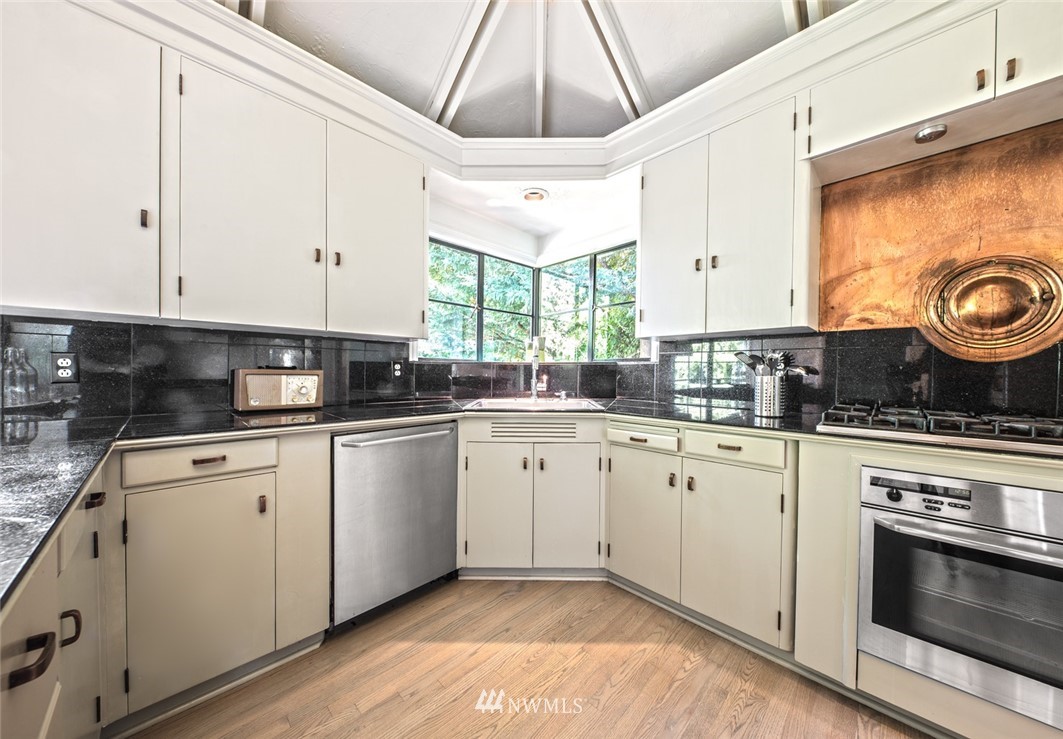 1668 East Boston Terrace Seattle, WA 98112 - Photo 8 of 24 a kitchen with a stove a sink and a microwave