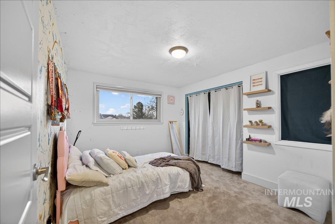 4393 North Edelweiss Street Boise, ID 83713 - Photo 21 of 42 Bedroom with carpet and a textured ceiling