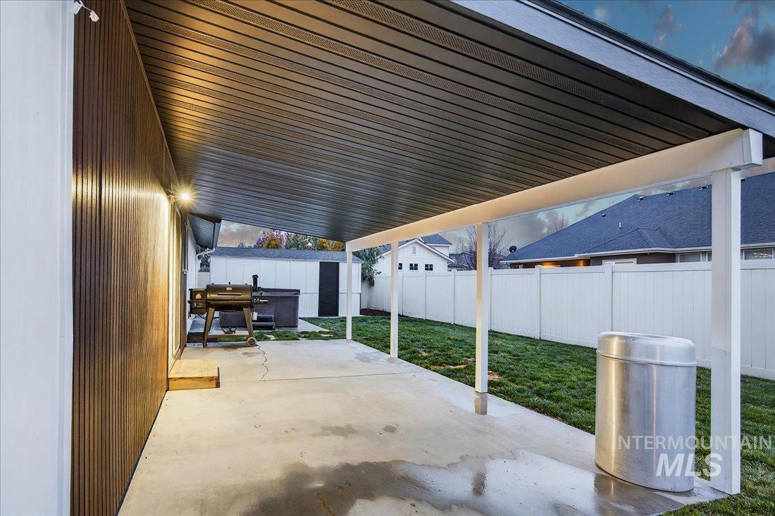 4393 North Edelweiss Street Boise, ID 83713 - Photo 37 of 42 Fenced backyard featuring a patio, grilling area, and a storage unit
