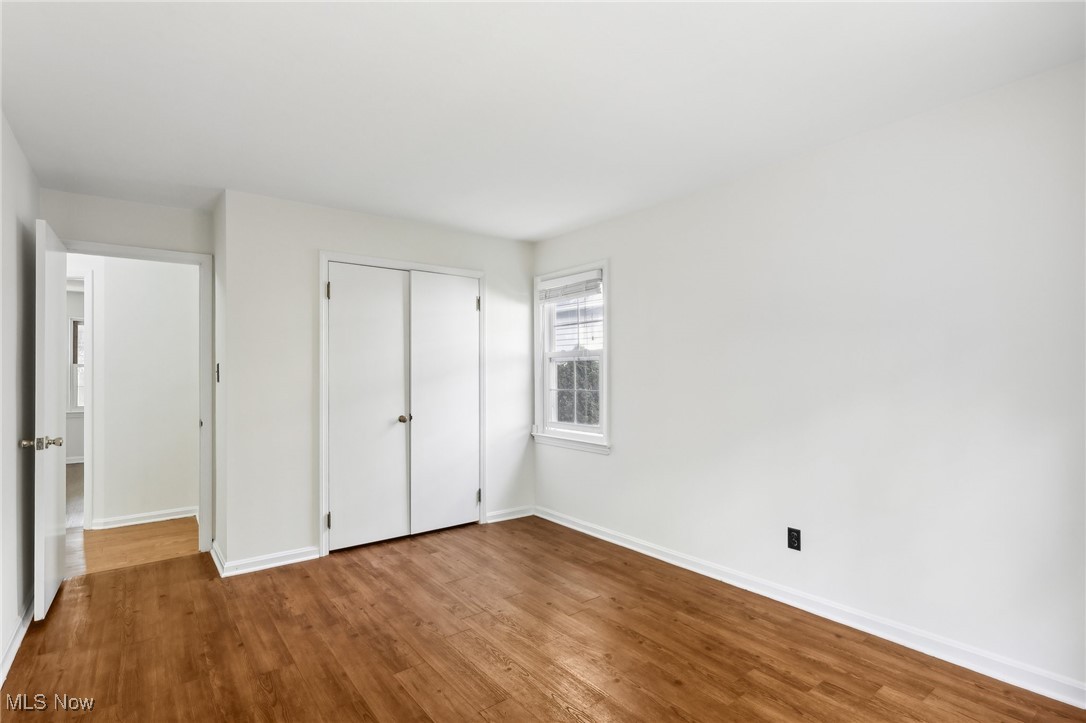 1042 Renfield Road Cleveland Heights, OH 44121 - Photo 16 of 49 Unfurnished bedroom featuring light hardwood / wood-style flooring and a closet