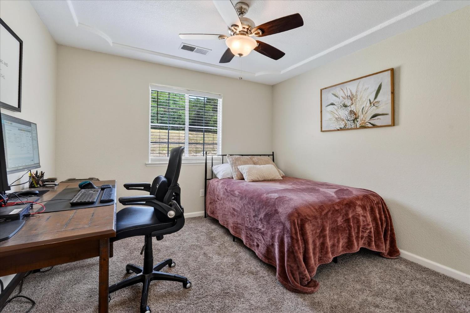 47482 Veater Ranch Road Coarsegold, CA 93614 - Photo 35 of 51 a bedroom with a bed and a desk