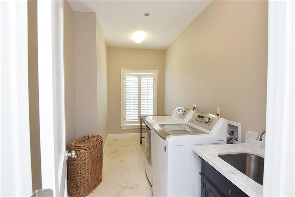 8 North Sewalls Point Road Sewall's Point, FL 34996 - Photo 26 of 33 a utility room with a sink washer and dryer