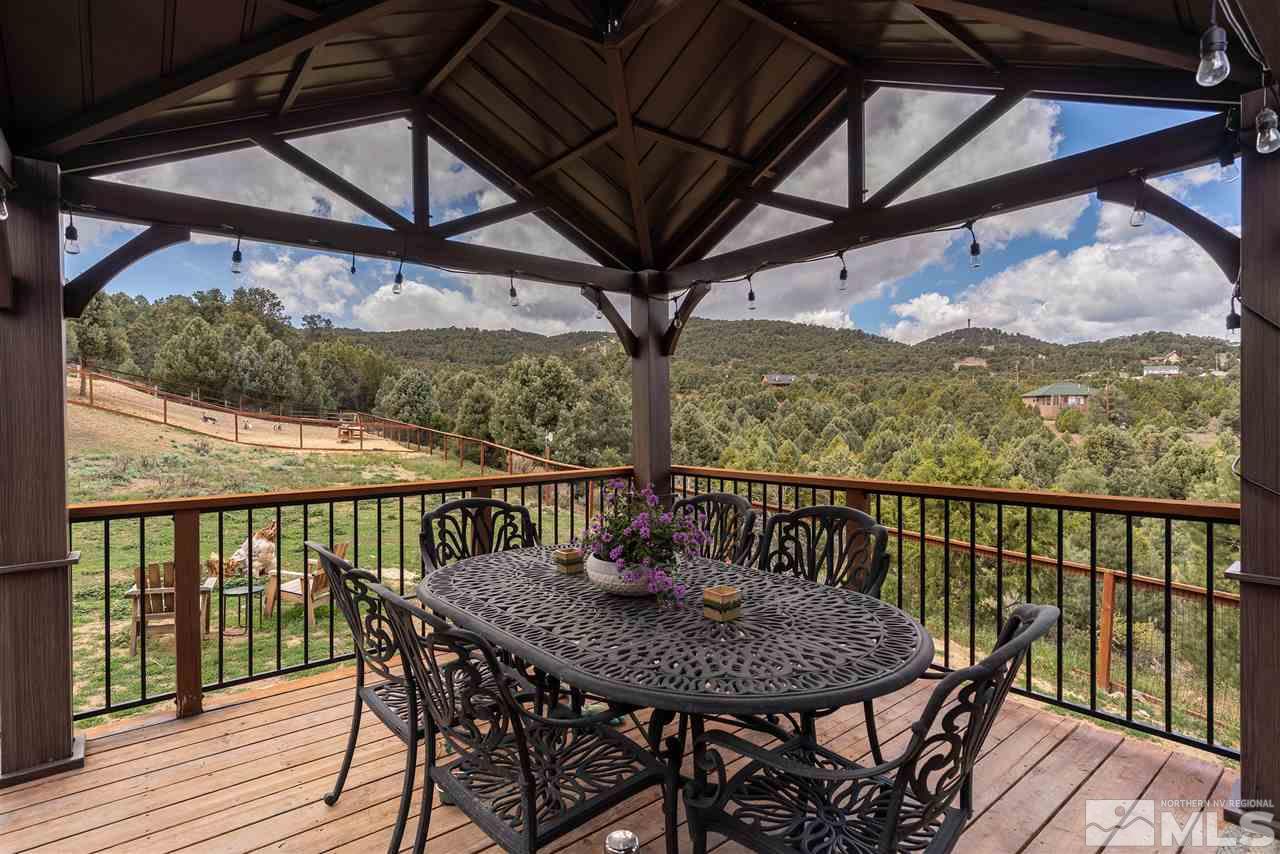 1844 Lousetown Road Reno, NV 89521 - Photo 20 of 39 a view of a balcony with furniture and wooden floor