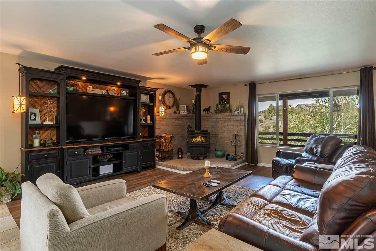 1844 Lousetown Road Reno, NV 89521 - Photo 3 of 39 a living room with furniture and a flat screen tv