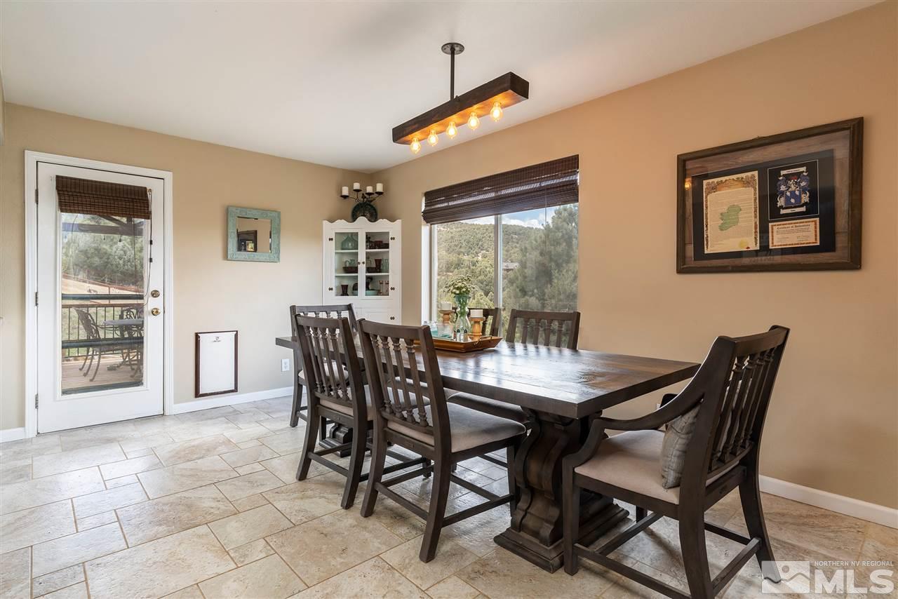 1844 Lousetown Road Reno, NV 89521 - Photo 7 of 39 a view of a dining room with furniture and a window