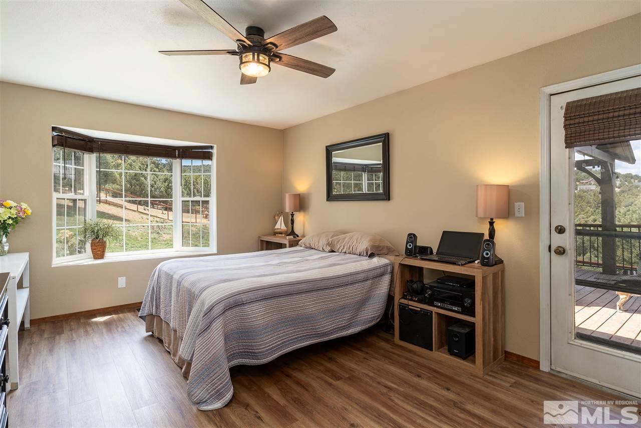 1844 Lousetown Road Reno, NV 89521 - Photo 8 of 39 a bedroom with a bed dresser and a window