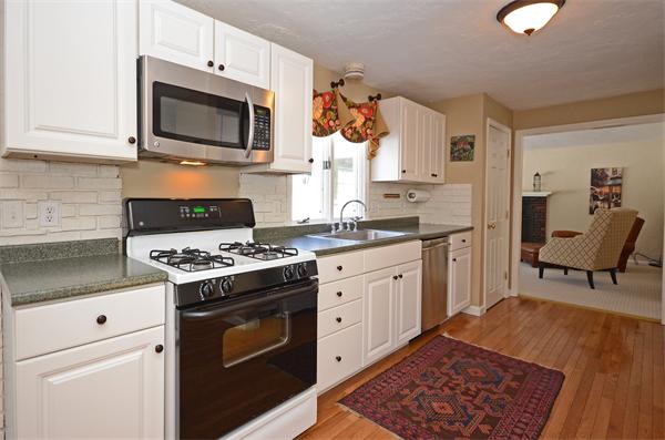 16 Nicholas Road Hopkinton, MA 01748 - Photo 11 of 28 a kitchen with a stove and a microwave