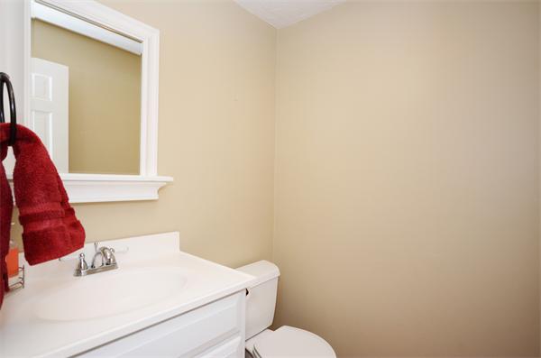 16 Nicholas Road Hopkinton, MA 01748 - Photo 13 of 28 a white toilet sitting next to a white sink and vanity