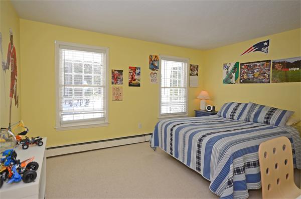 16 Nicholas Road Hopkinton, MA 01748 - Photo 15 of 28 a bed sitting in a bedroom next to a window