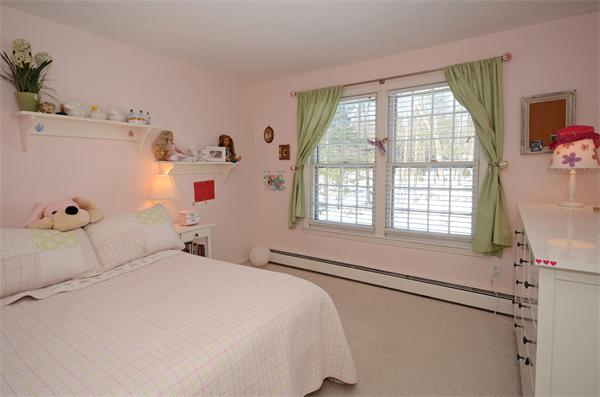 16 Nicholas Road Hopkinton, MA 01748 - Photo 17 of 28 a bedroom with a bed and a large window