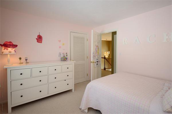 16 Nicholas Road Hopkinton, MA 01748 - Photo 18 of 28 a bedroom with a bed a dresser and a mirror