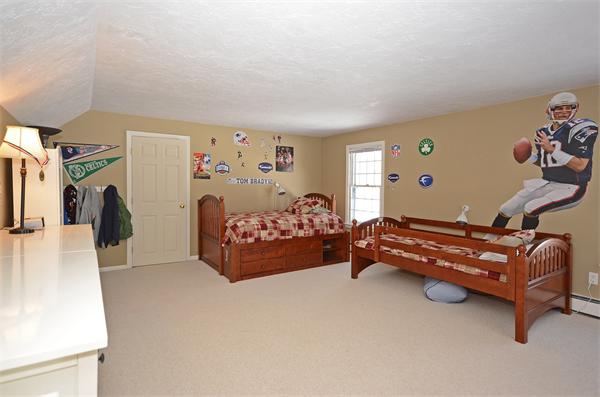 16 Nicholas Road Hopkinton, MA 01748 - Photo 19 of 28 a bedroom with furniture and a bed