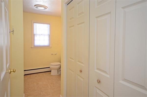 16 Nicholas Road Hopkinton, MA 01748 - Photo 21 of 28 a bathroom with a granite countertop sink a toilet and a shower