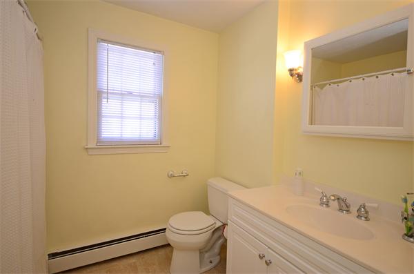 16 Nicholas Road Hopkinton, MA 01748 - Photo 22 of 28 a bathroom with a sink a toilet and shower