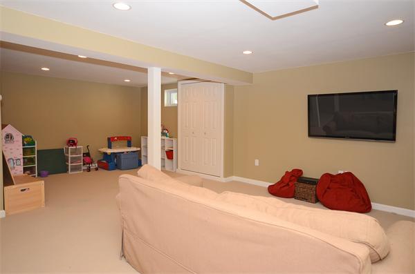 16 Nicholas Road Hopkinton, MA 01748 - Photo 24 of 28 a bedroom with a bed and a flat screen tv