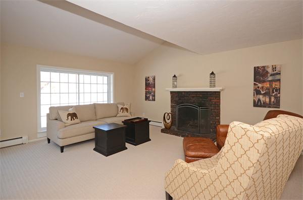 16 Nicholas Road Hopkinton, MA 01748 - Photo 7 of 28 a living room with furniture and a fireplace