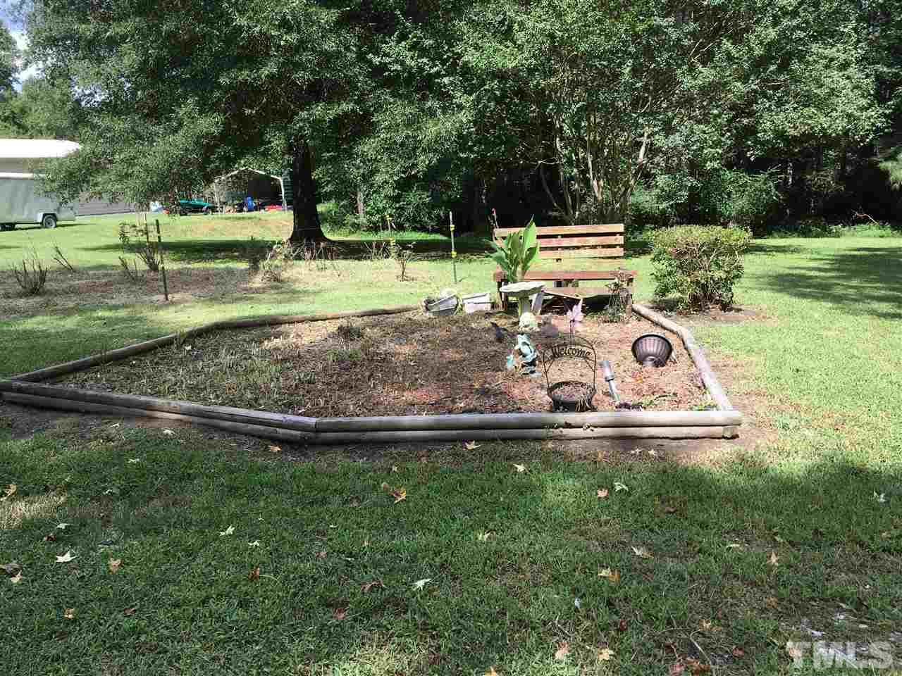4115 Suitt Road Durham, NC 27703 - Photo 22 of 24 a view of a park with large trees