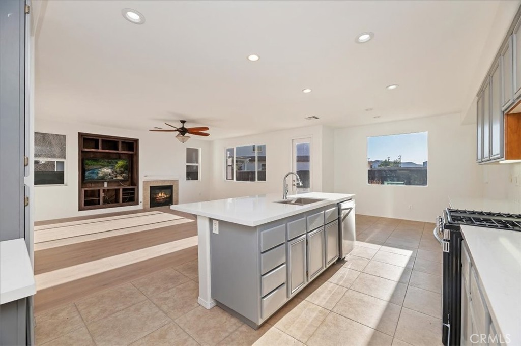 3215 Tumbleweed Road Hemet, CA 92545 - Photo 22 of 46 a kitchen with stainless steel appliances granite countertop a sink and dishwasher with a large kitchen island