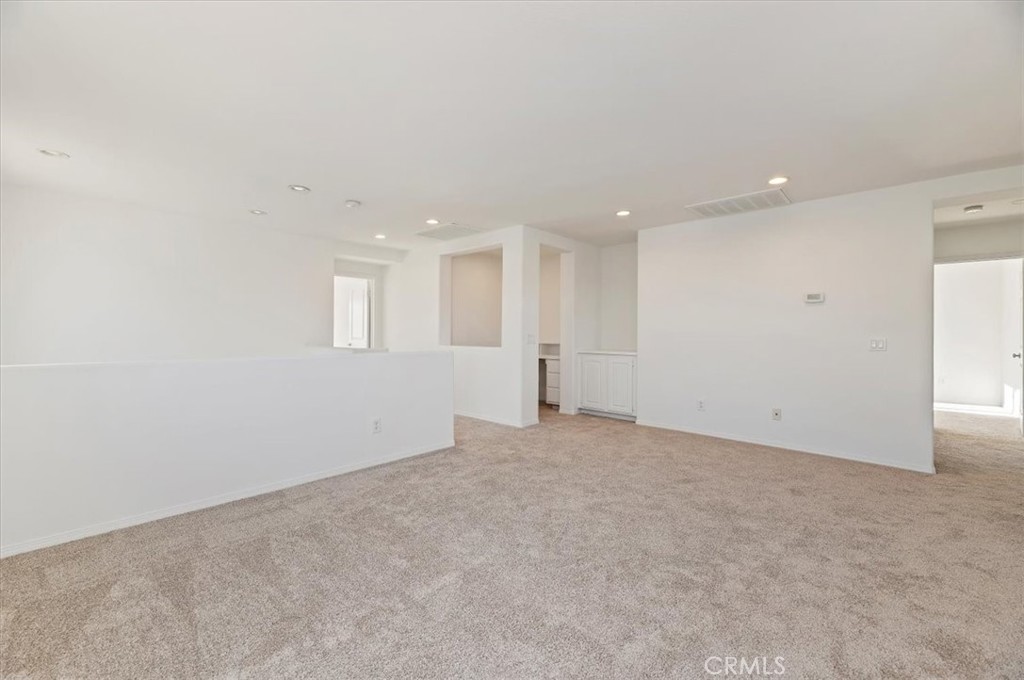 3215 Tumbleweed Road Hemet, CA 92545 - Photo 26 of 46 a view of an empty room with a kitchen