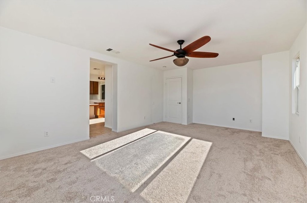 3215 Tumbleweed Road Hemet, CA 92545 - Photo 35 of 46 a view of a room with a ceiling fan and a chandelier fan