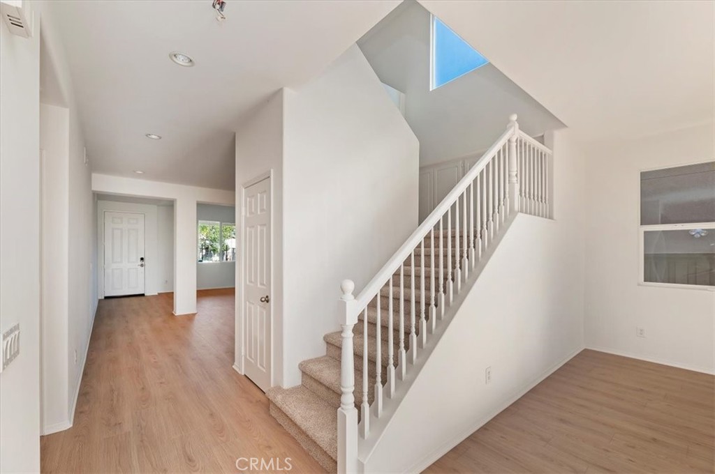3215 Tumbleweed Road Hemet, CA 92545 - Photo 7 of 46 a view of a hallway with wooden floor and entryway