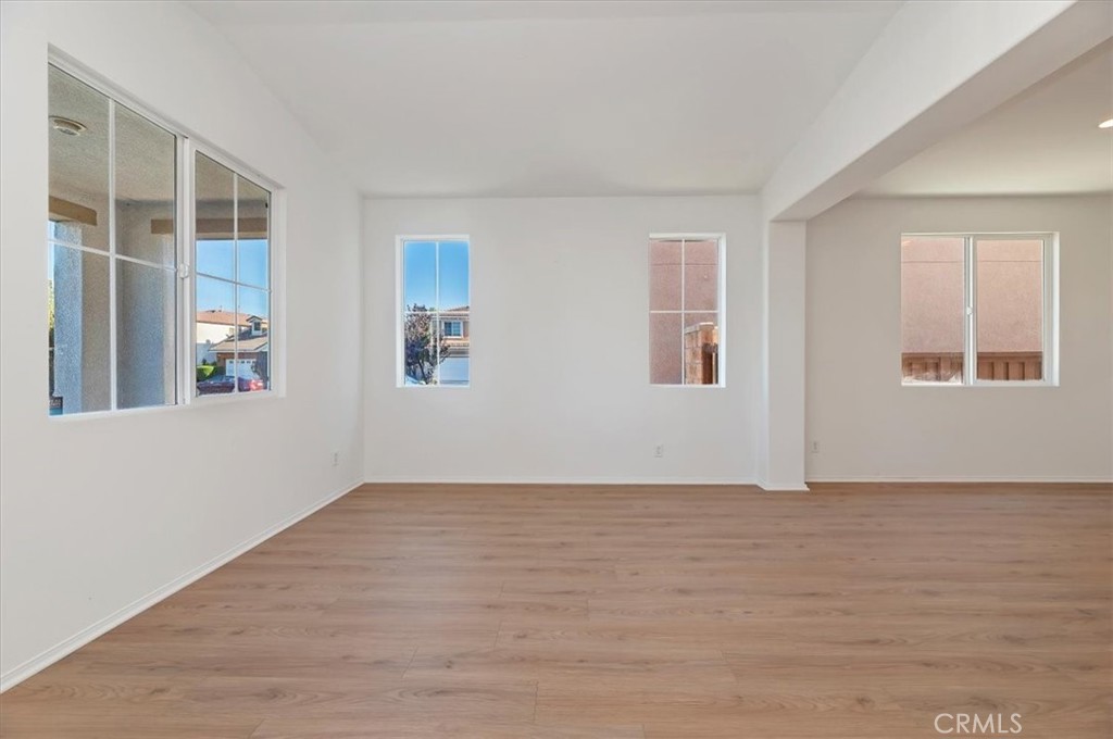 3215 Tumbleweed Road Hemet, CA 92545 - Photo 8 of 46 a view of an empty room with window and wooden floor