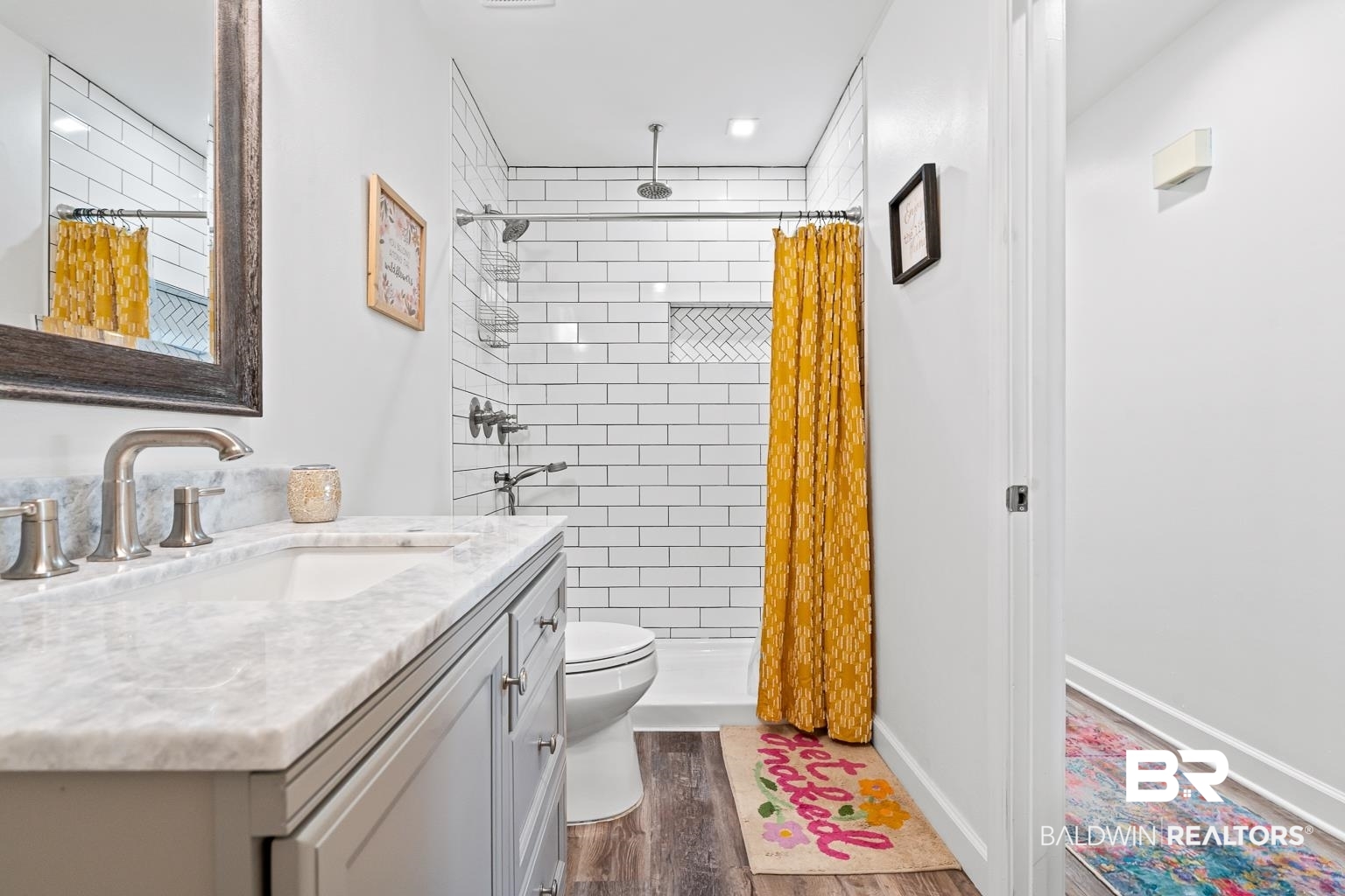6801 Piney Woods Road Foley, AL 36535 - Photo 50 of 74 Full bathroom with a stall shower, dark wood finished floors, and vanity