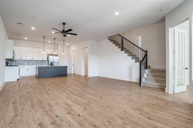 a view of a kitchen with a sink and cabinets