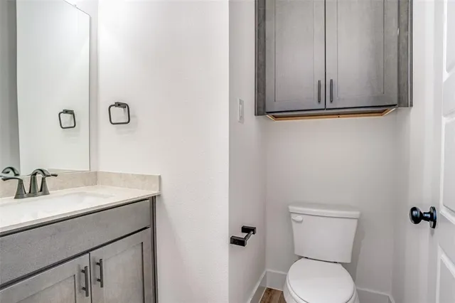 a kitchen with a sink a center island a stove and a refrigerator