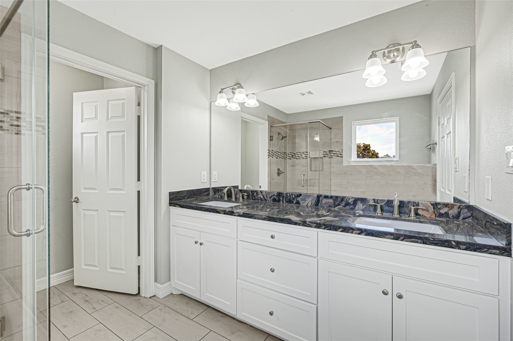 9823 Bamboo Road, Unit B Houston, TX 77041 - Photo 29 of 33 Additional view of the bathroom showcasing the vanity and updated finishes.