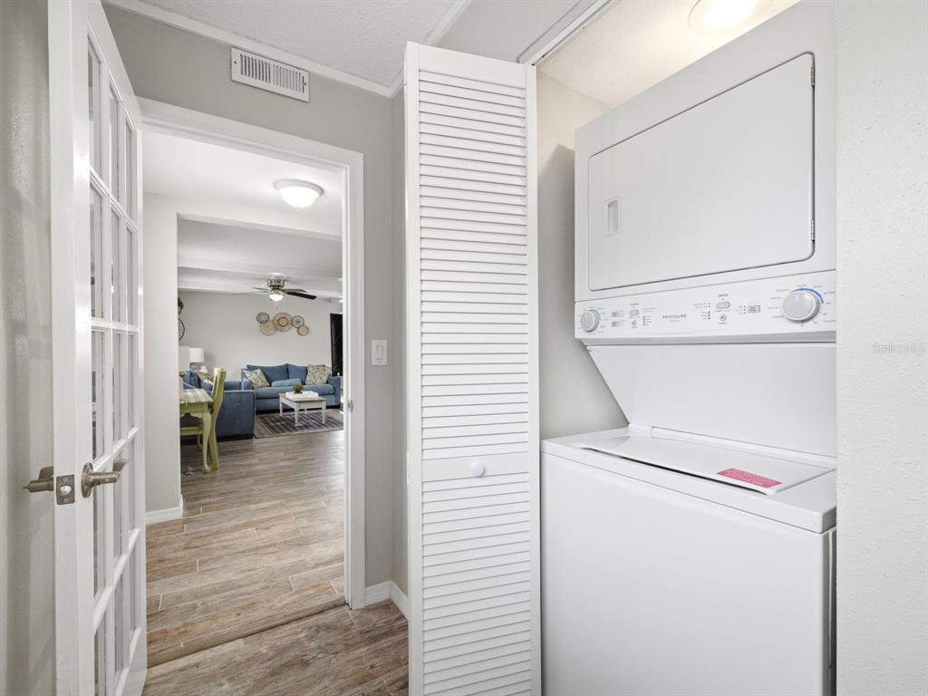 1207 1st Street Indian Rocks Beach, FL 33785 - Photo 26 of 60 a hallway with a washer and dryer