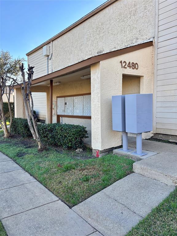 12480 Abrams Road, Unit 2805 Dallas, TX 75243 - Photo 6 of 18 View of home's exterior with mail area and stucco siding