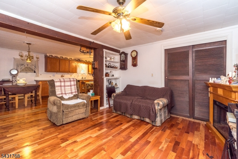 400 Mechlin Corner Road Pittstown, NJ 08867 - Photo 6 of 29 a living room with furniture and a flat screen tv