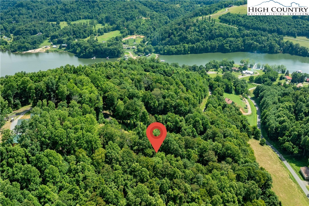 Lot 30 Lake Ridge Butler, TN 37640 - Photo 23 of 30 a backyard of a house with a yard and outdoor seating