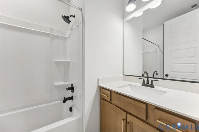 a bathroom with a sink a toilet and a bathtub