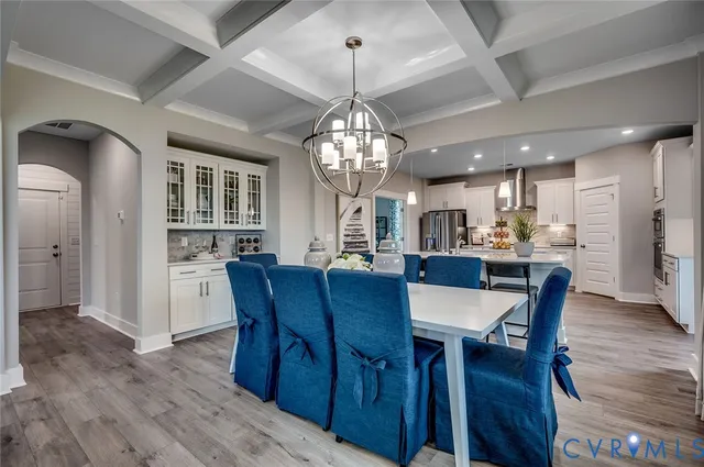 an aerial view of a swimming pool with outdoor seating