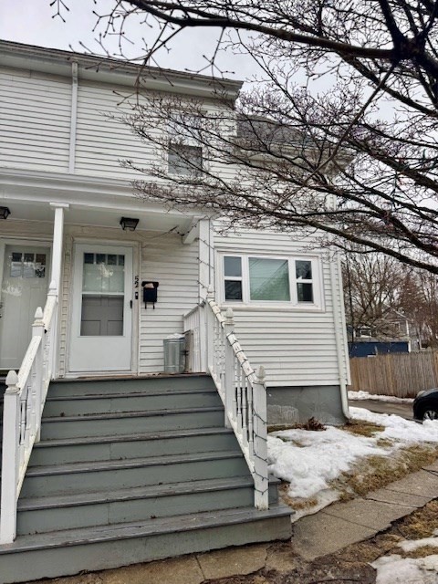52 Curve Street, Unit 52 Dedham, MA 02026 - Photo 11 of 11 a view of a house with wooden fence
