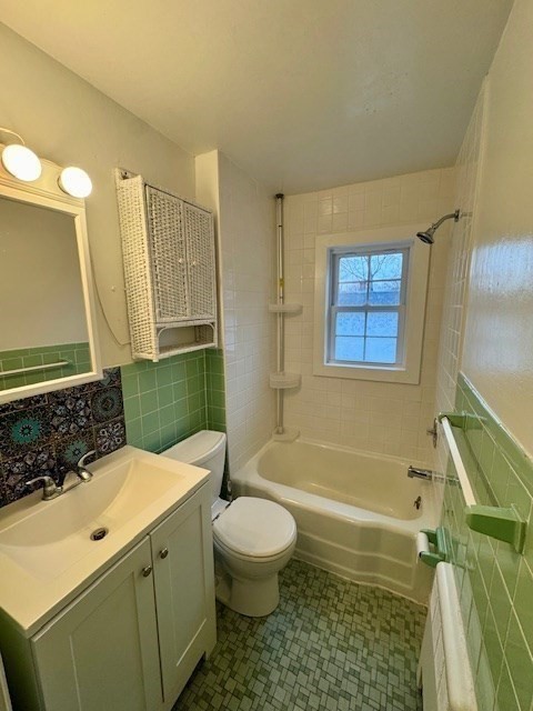 52 Curve Street, Unit 52 Dedham, MA 02026 - Photo 6 of 11 a bathroom with a sink a toilet and shower