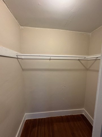 52 Curve Street, Unit 52 Dedham, MA 02026 - Photo 9 of 11 a view of a room with racks on the wall