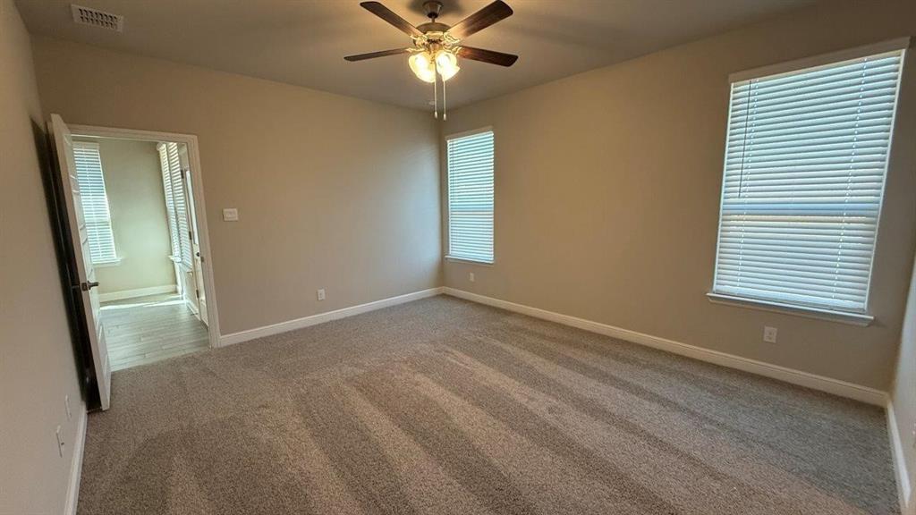 1918 Jackson Street Cleburne, TX 76033 - Photo 4 of 20 a view of an empty room with a window