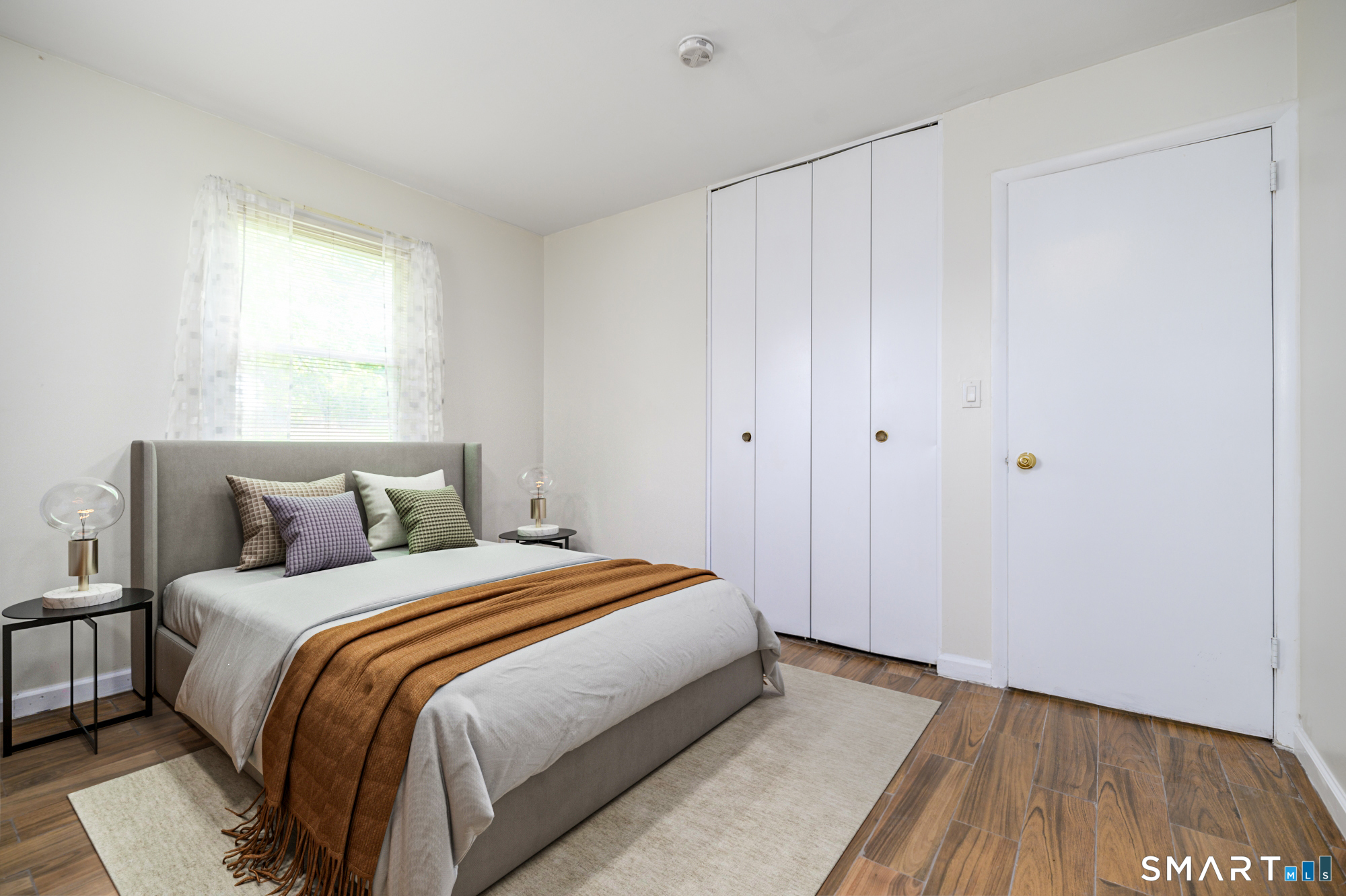 472 Anton Street Bridgeport, CT 06606 - Photo 11 of 23 a bedroom with a bed and a window